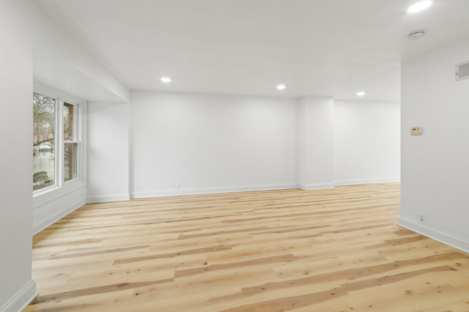 28 Dunlap Road Park Forest, IL 60466 - Photo 8 of 17 a view of an empty room with wooden floor and a window