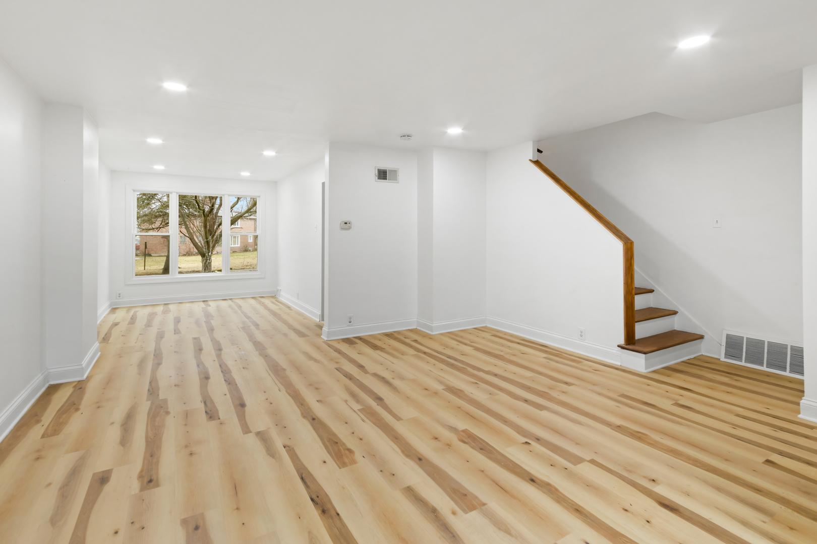 28 Dunlap Road Park Forest, IL 60466 - Photo 9 of 17 a view of empty room with wooden floor and fan