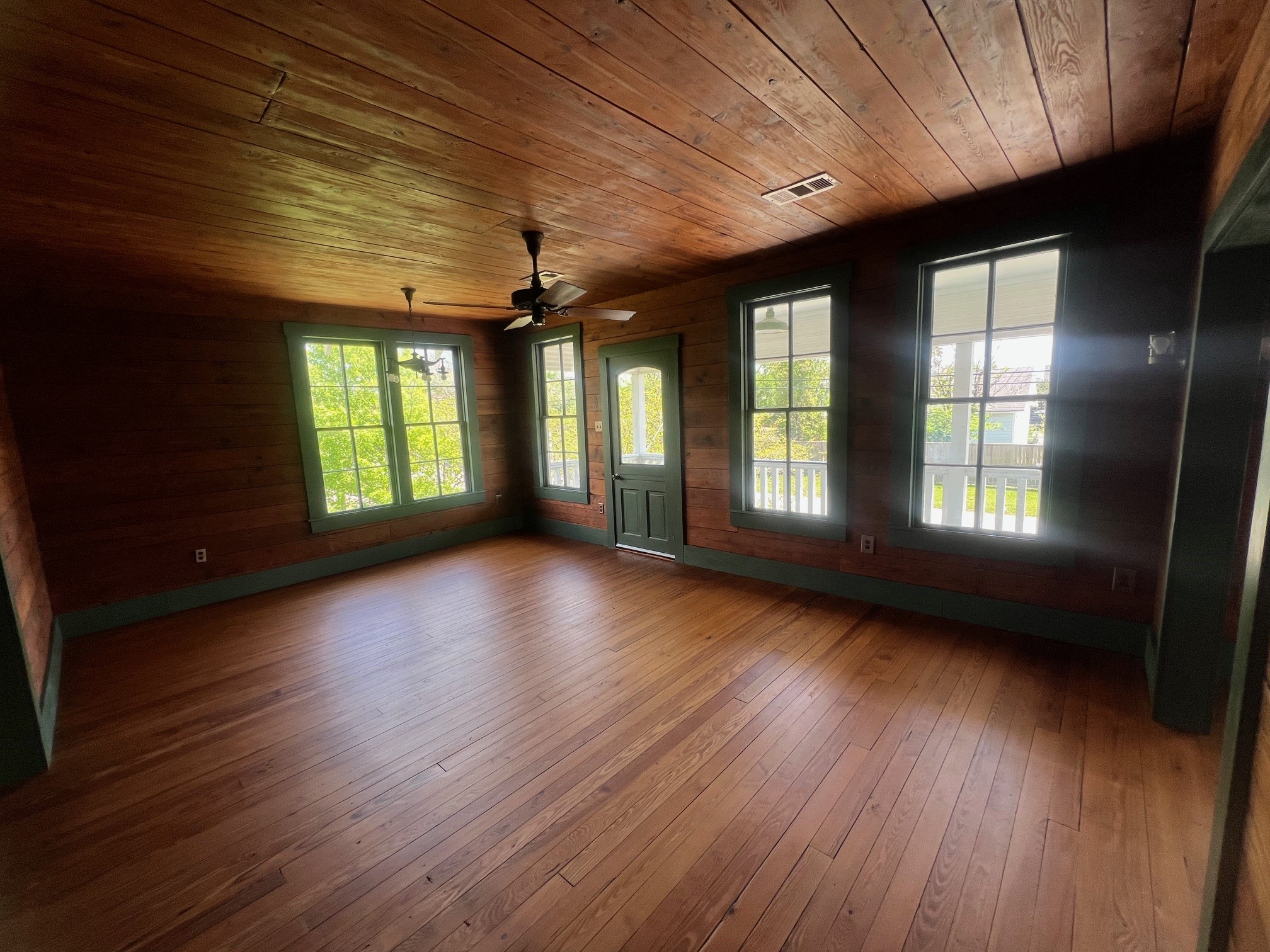 618 Bayridge Road La Porte, TX 77571 - Photo 12 of 50 an empty room with wooden floor and windows
