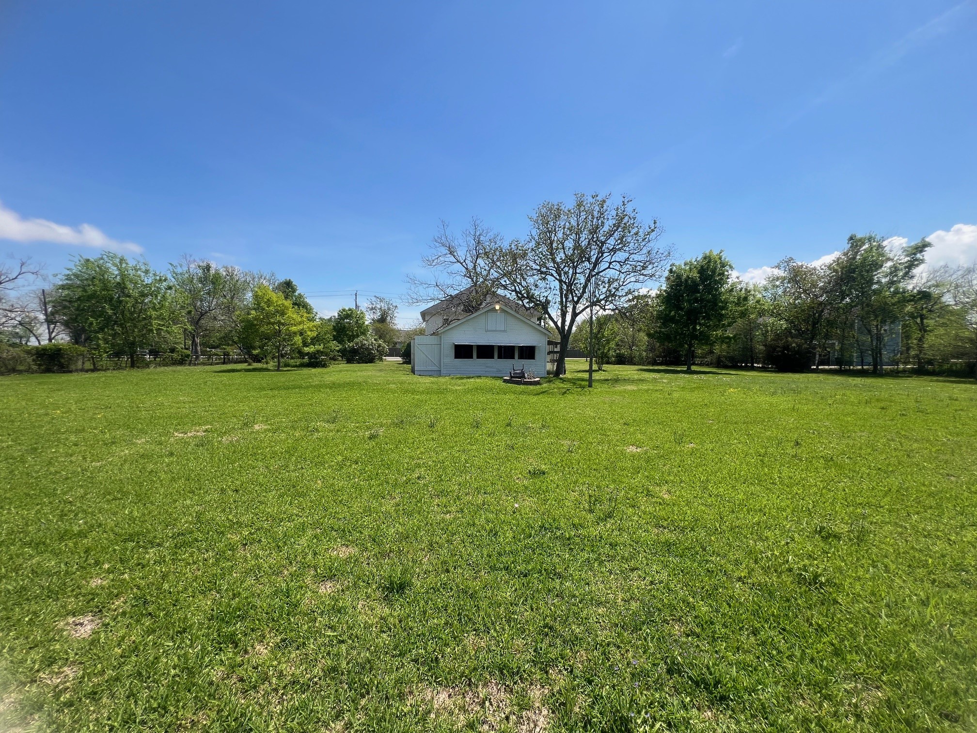 618 Bayridge Road La Porte, TX 77571 - Photo 47 of 50 a view of a green field with trees in the background
