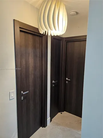 a bathroom with a mirror and a shower