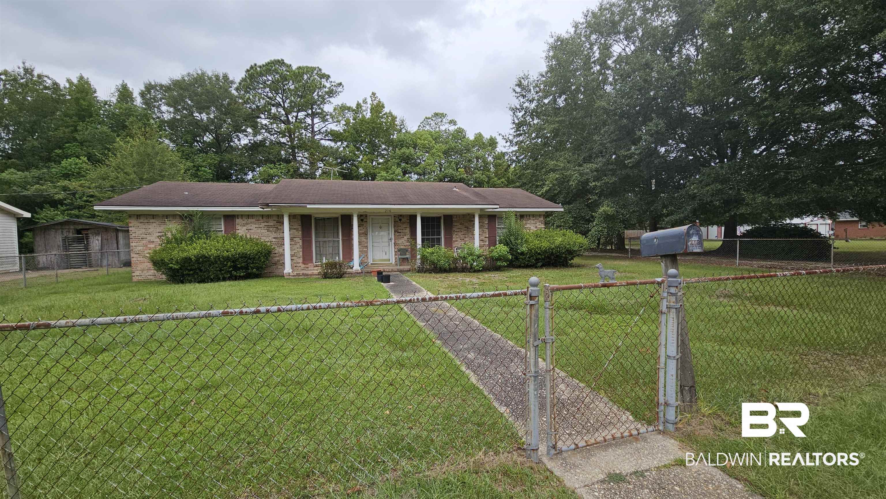 216 6th Avenue Atmore, AL 36502 - Photo 1 of 34 Single story home featuring a front lawn