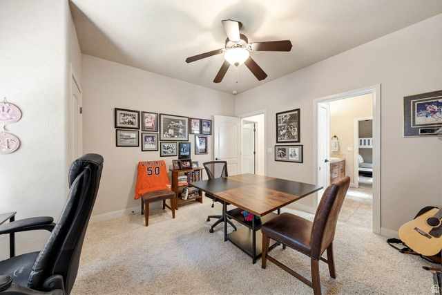 1609 East 10 S Street St. George, UT 84790 - Photo 41 of 68 Carpeted room with a ceiling fan, two doorways, and neutral wall paint