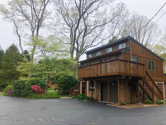 190 Jackson Mills Road Jackson, NJ 08527 - Photo 1 of 11 a front view of a house with a garden