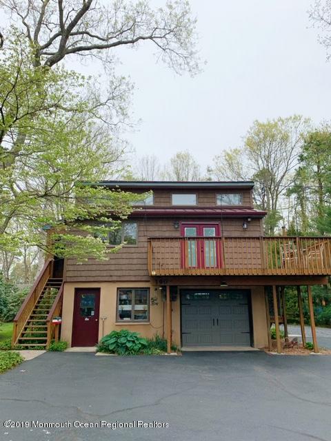 190 Jackson Mills Road Jackson, NJ 08527 - Photo 3 of 11 a front view of a house with a garden