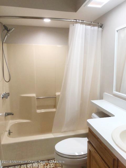 190 Jackson Mills Road Jackson, NJ 08527 - Photo 9 of 11 a bathroom with a sink a toilet and shower