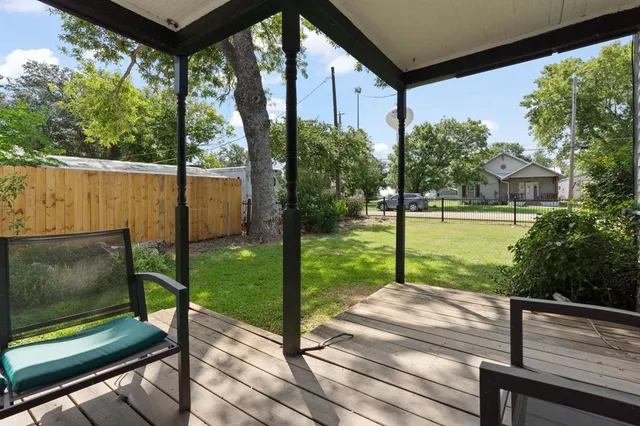 a view of a two chairs in the balcony