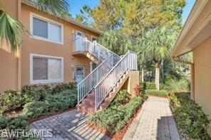1670 Windy Pines Drive, Unit 2510 Naples, FL 34112 - Photo 1 of 9 a view of a house with brick walls