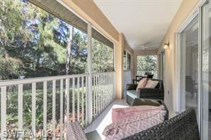 1670 Windy Pines Drive, Unit 2510 Naples, FL 34112 - Photo 2 of 9 a view of a balcony with furniture