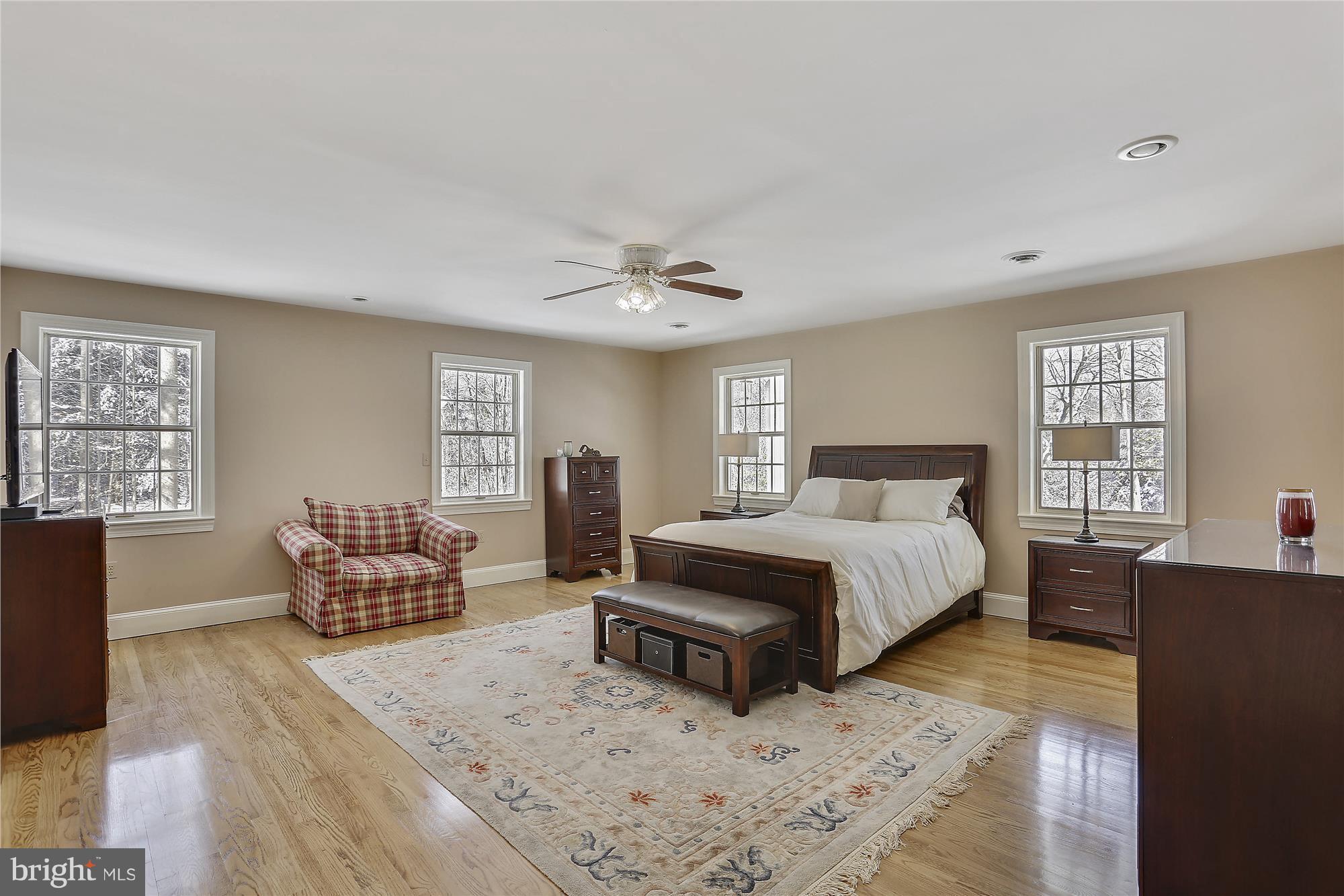 1711 Ashton Road Ashton, MD 20861 - Photo 14 of 30 a spacious bedroom with a bed and wooden floor