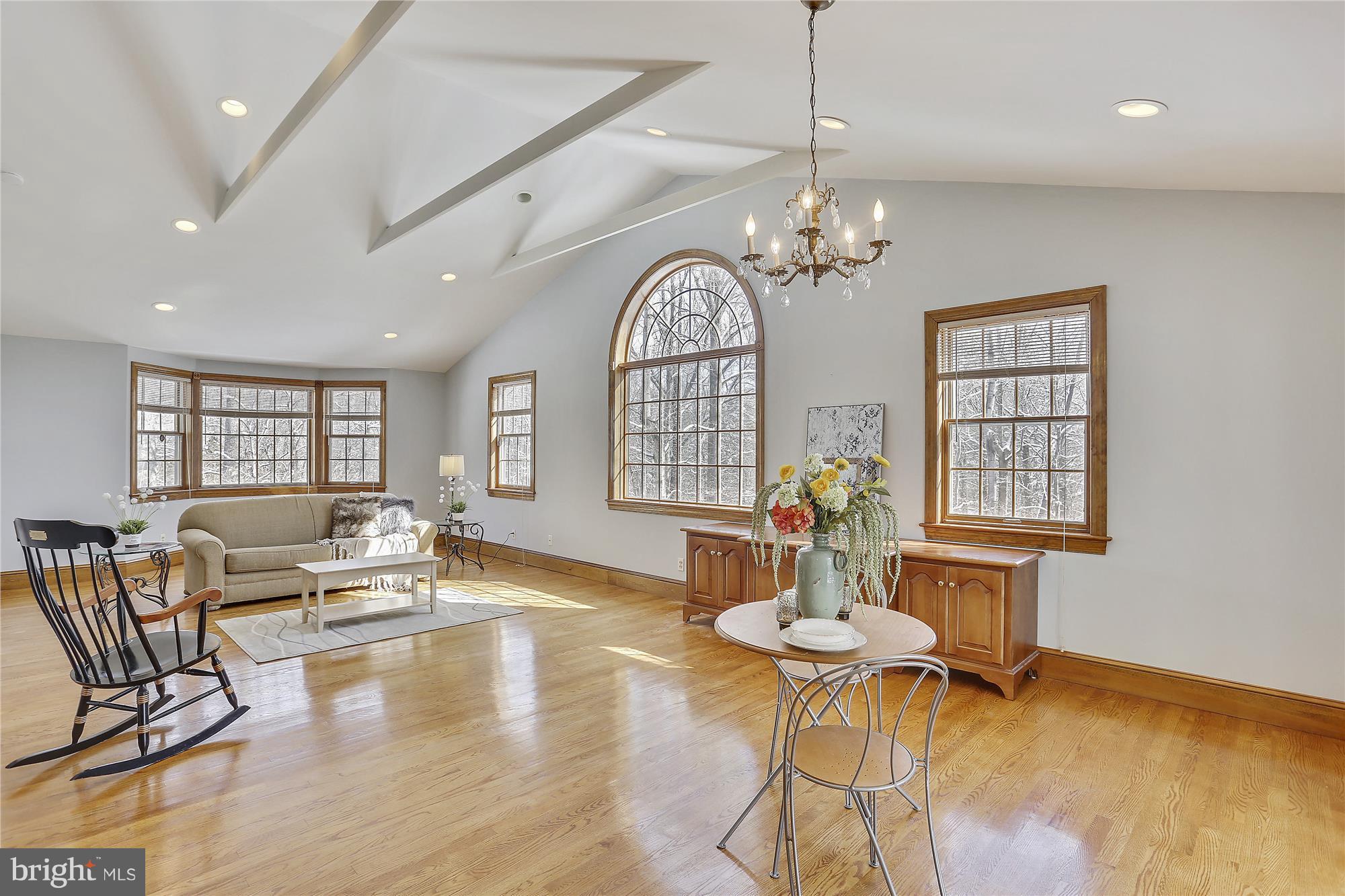 1711 Ashton Road Ashton, MD 20861 - Photo 20 of 30 a view of a dining room with furniture a chandelier and wooden floor