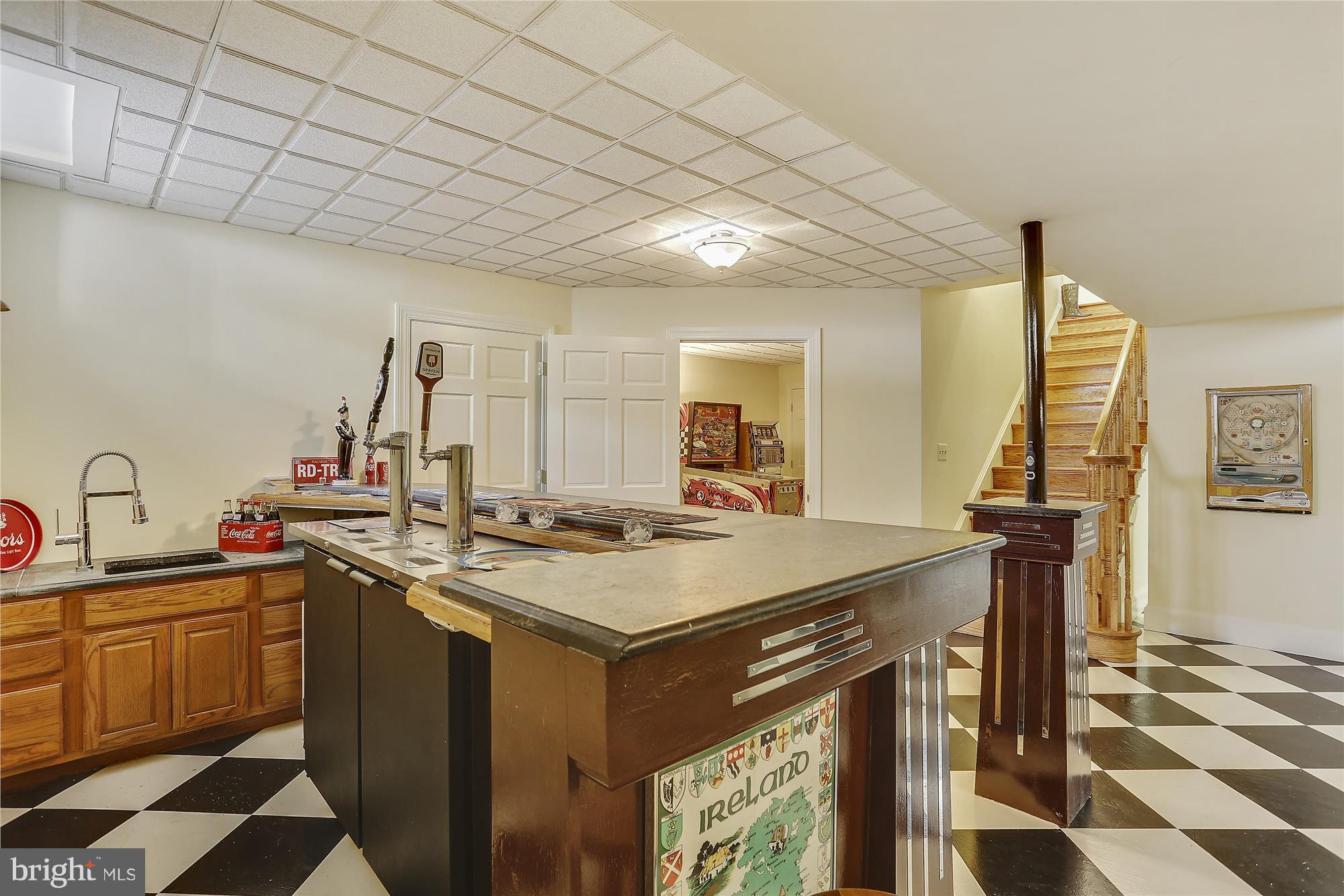 1711 Ashton Road Ashton, MD 20861 - Photo 23 of 30 a view of a kitchen counter space a sink wooden floor and furniture
