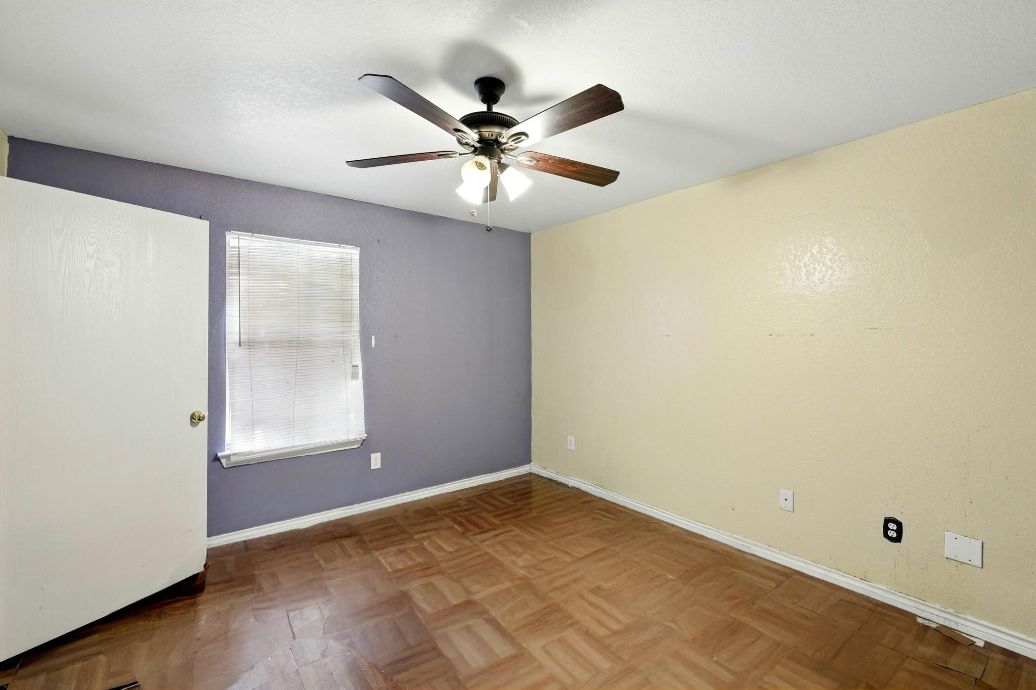 2005 Worms Street Houston, TX 77020 - Photo 6 of 11 an empty room with a window and a fan