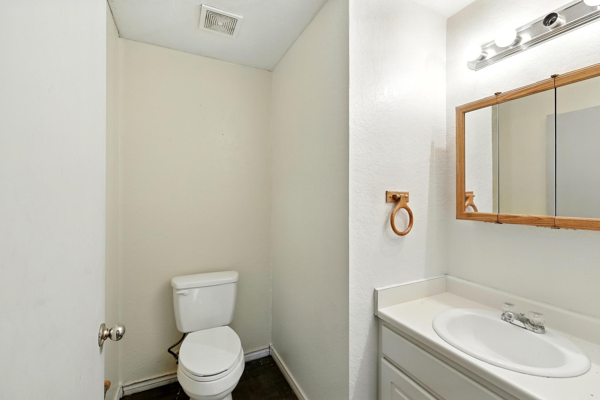 2005 Worms Street Houston, TX 77020 - Photo 8 of 11 a bathroom with a sink mirror vanity and toilet