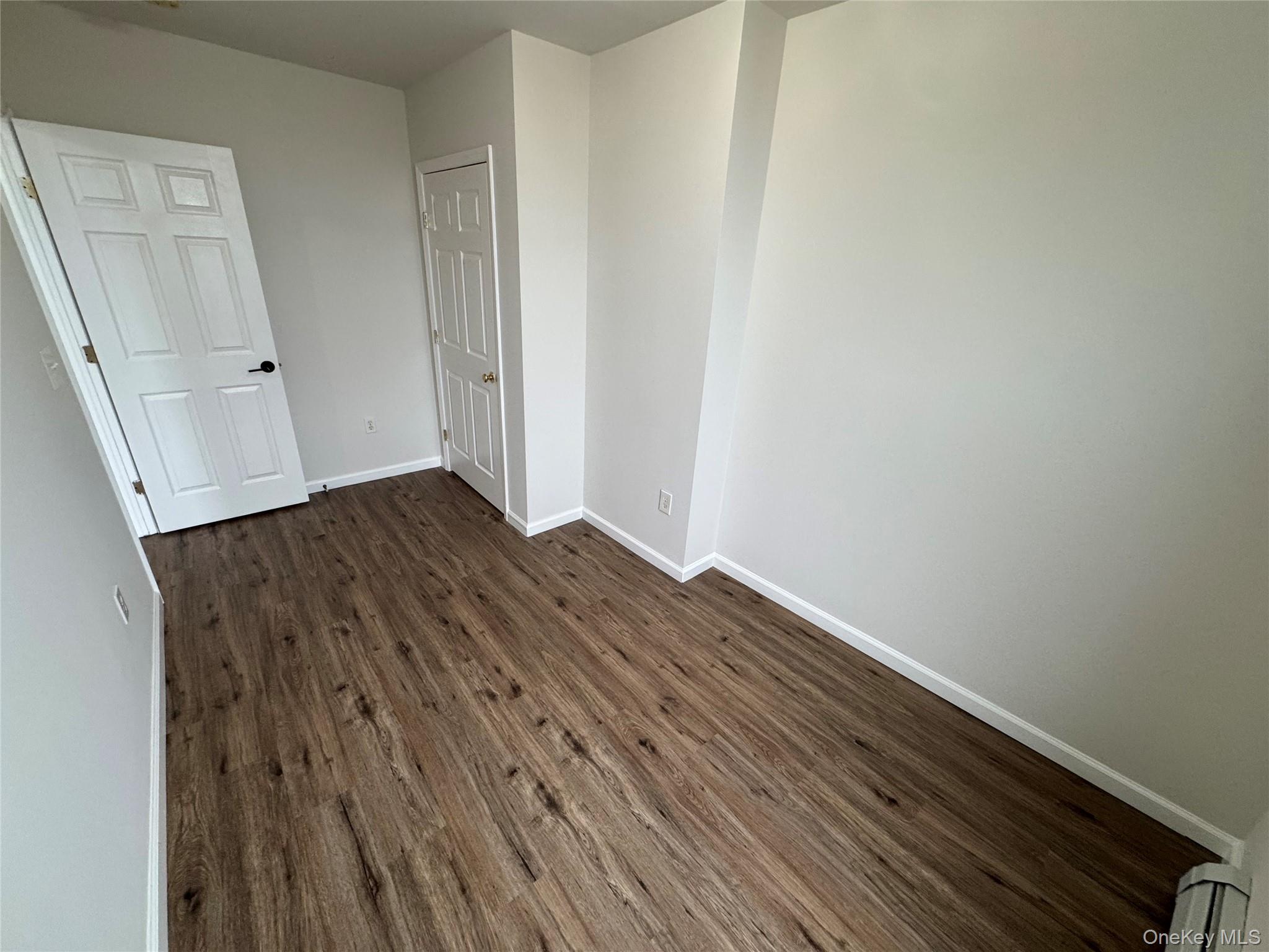 315 Main Street, Unit 3 Poughkeepsie, NY 12601 - Photo 12 of 13 a view of an empty room with wooden floor
