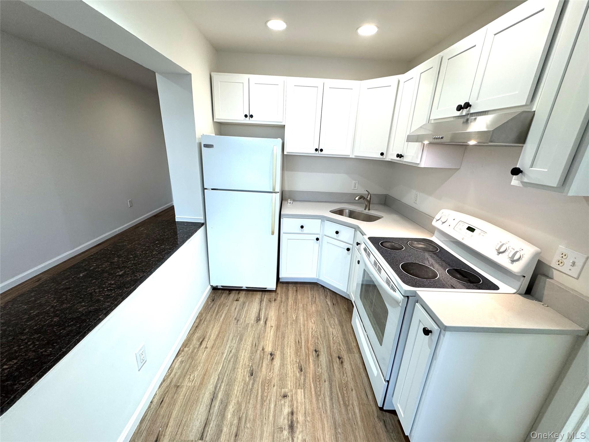 315 Main Street, Unit 3 Poughkeepsie, NY 12601 - Photo 6 of 13 a kitchen with a sink a stove and refrigerator