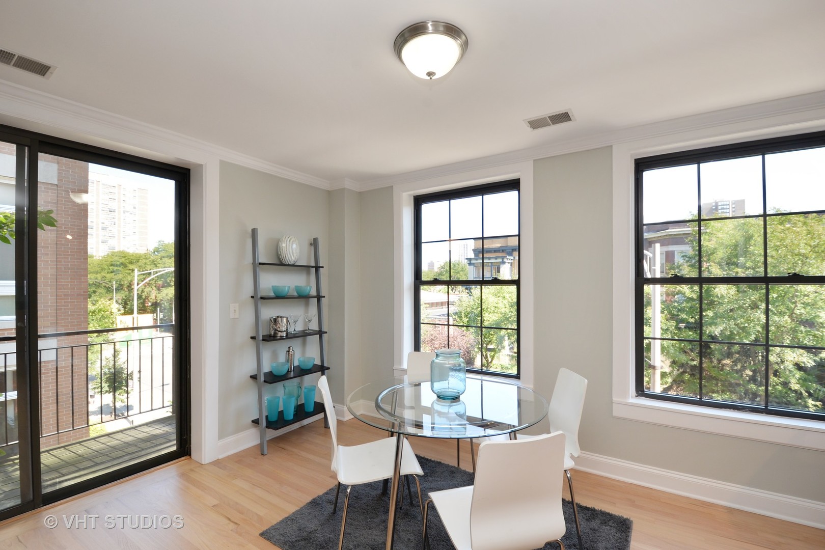 4144 North Sheridan Road, Unit 311 Chicago, IL 60613 - Photo 6 of 10 a view of a dining room with furniture window and outside view