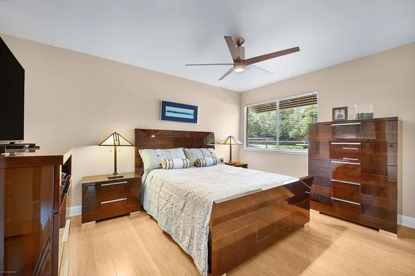 a bedroom with a bed and a dresser