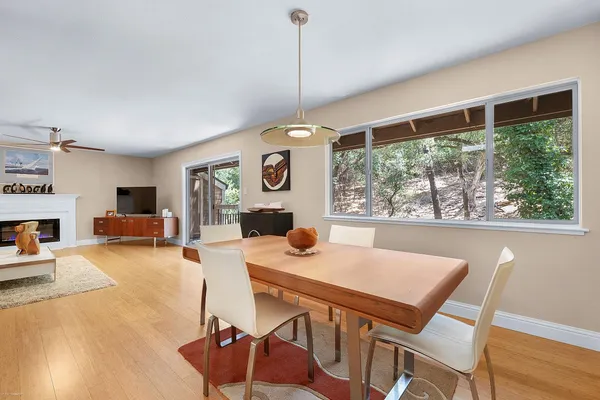 a dining room with furniture and window