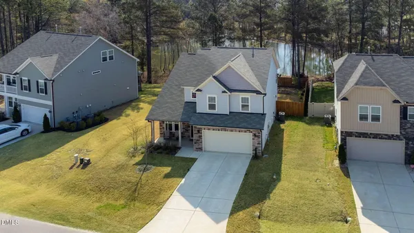 an aerial view of a house with swimming pool