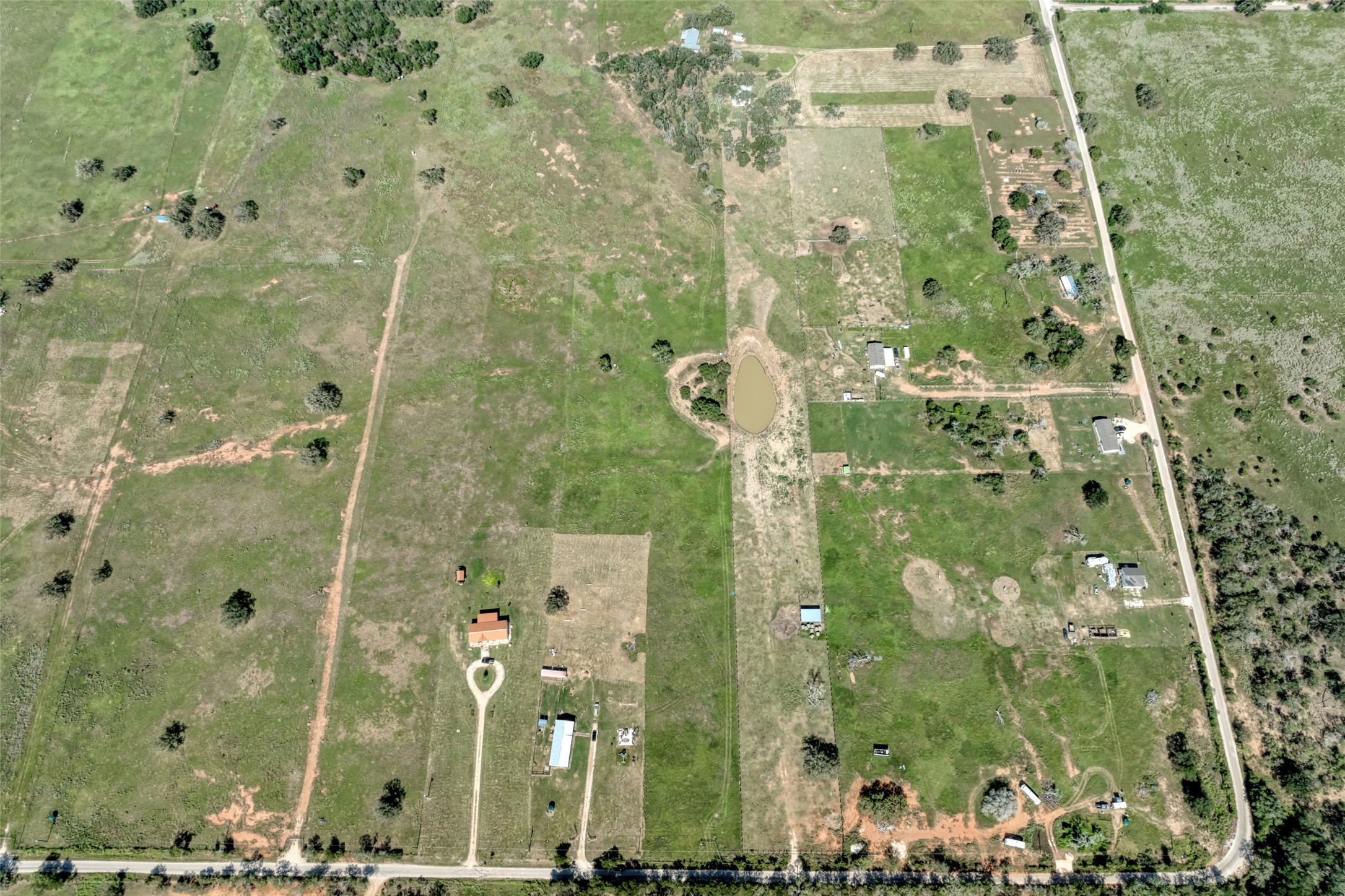 5309 Tenney Creek Road Luling, TX 78648 - Photo 15 of 23 Vast acreage features open pastures, a private pond, and multiple potential building sites.