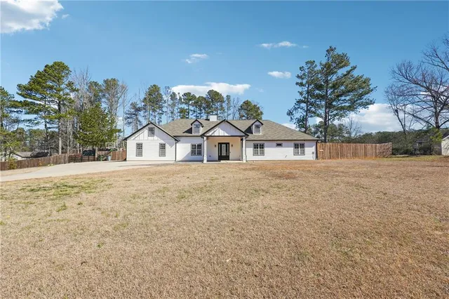 a house with trees in front of it