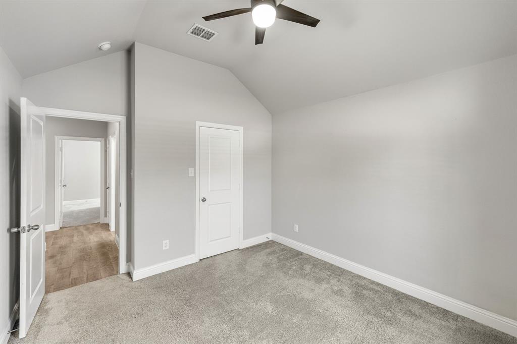 915 Timber Ridge Drive Justin, TX 76247 - Photo 33 of 39 Room with vaulted ceiling, ceiling fan, and light gray wall finish