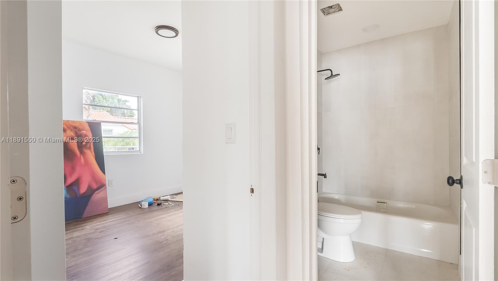 2100 Southwest 25th Street Miami, FL 33133 - Photo 11 of 23 a bathroom with a bathtub and a toilet