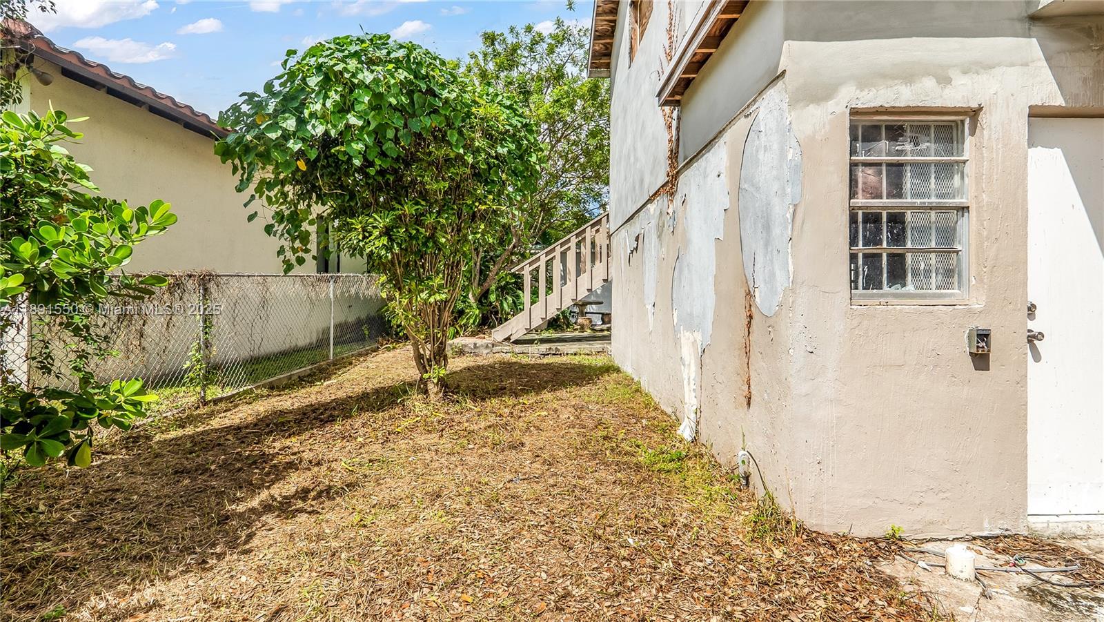 2100 Southwest 25th Street Miami, FL 33133 - Photo 13 of 23 a view of a pathway of a house with wooden fence