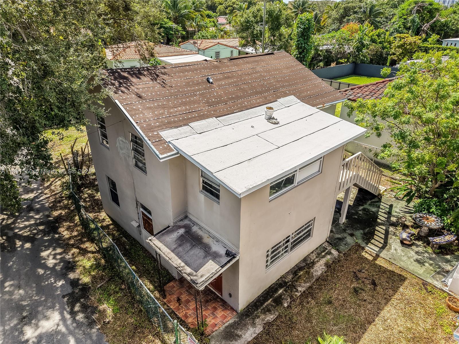 2100 Southwest 25th Street Miami, FL 33133 - Photo 20 of 23 a view of a house with roof deck