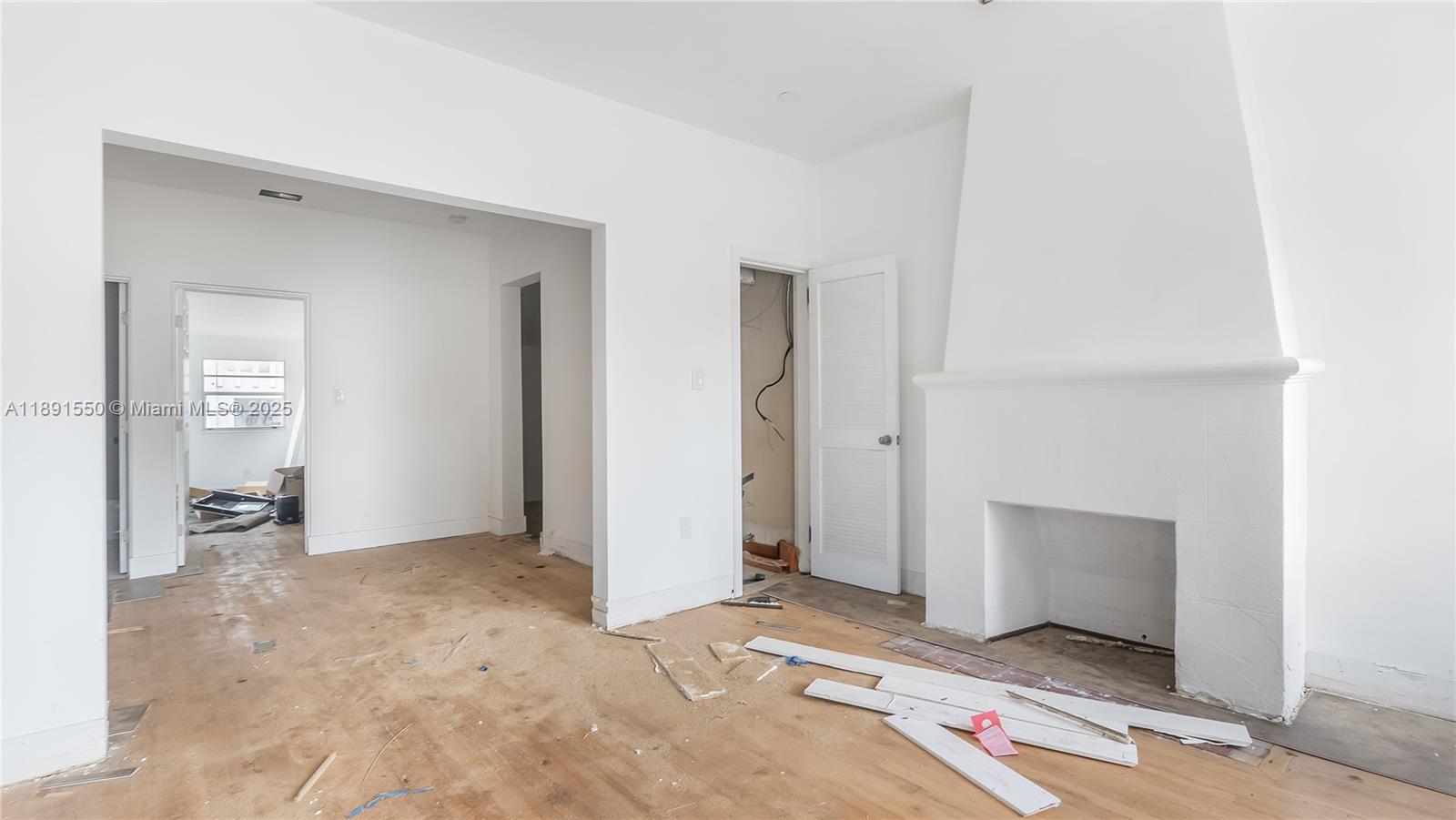 2100 Southwest 25th Street Miami, FL 33133 - Photo 8 of 23 a view of livingroom with hardwood floor and a bathroom