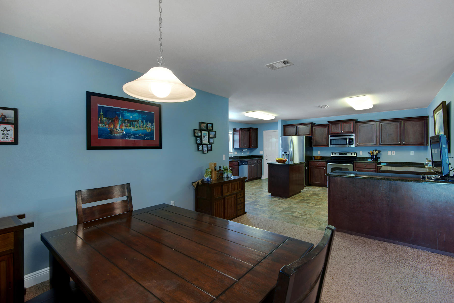 2383 Crescent Road Navarre, FL 32566 - Photo 11 of 48 a kitchen with a table and chairs in it