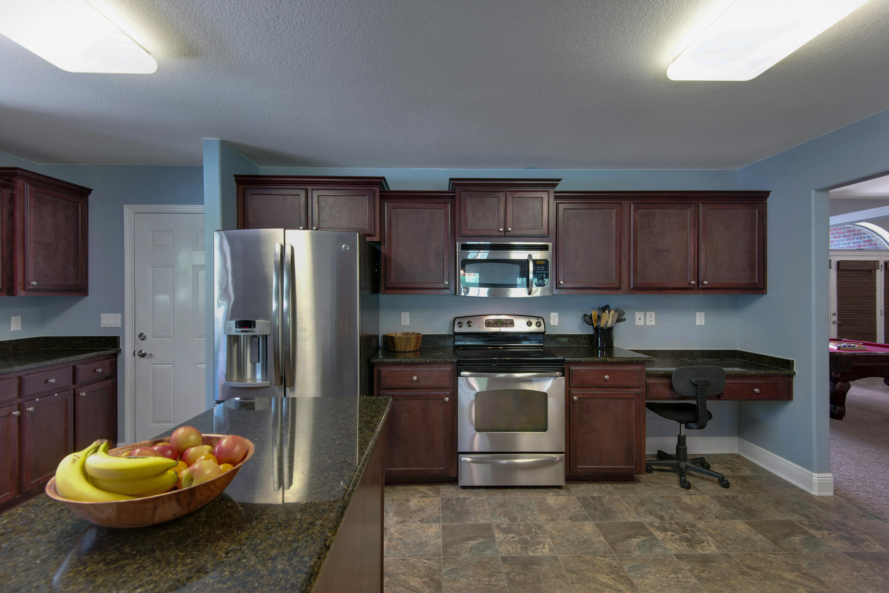 2383 Crescent Road Navarre, FL 32566 - Photo 14 of 48 a kitchen with stainless steel appliances kitchen island granite countertop a refrigerator stove and sink