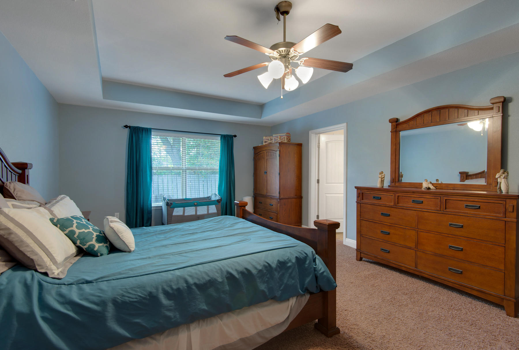 2383 Crescent Road Navarre, FL 32566 - Photo 17 of 48 a bedroom with a bed and a chandelier