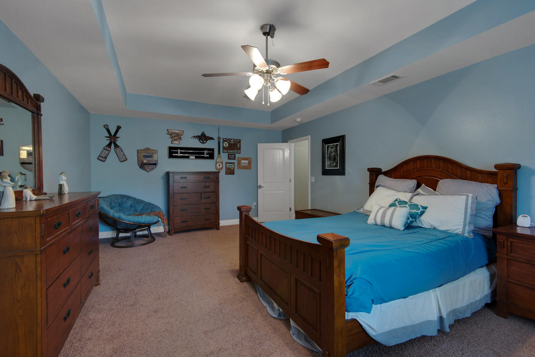 2383 Crescent Road Navarre, FL 32566 - Photo 18 of 48 a bedroom with a bed and a chandelier