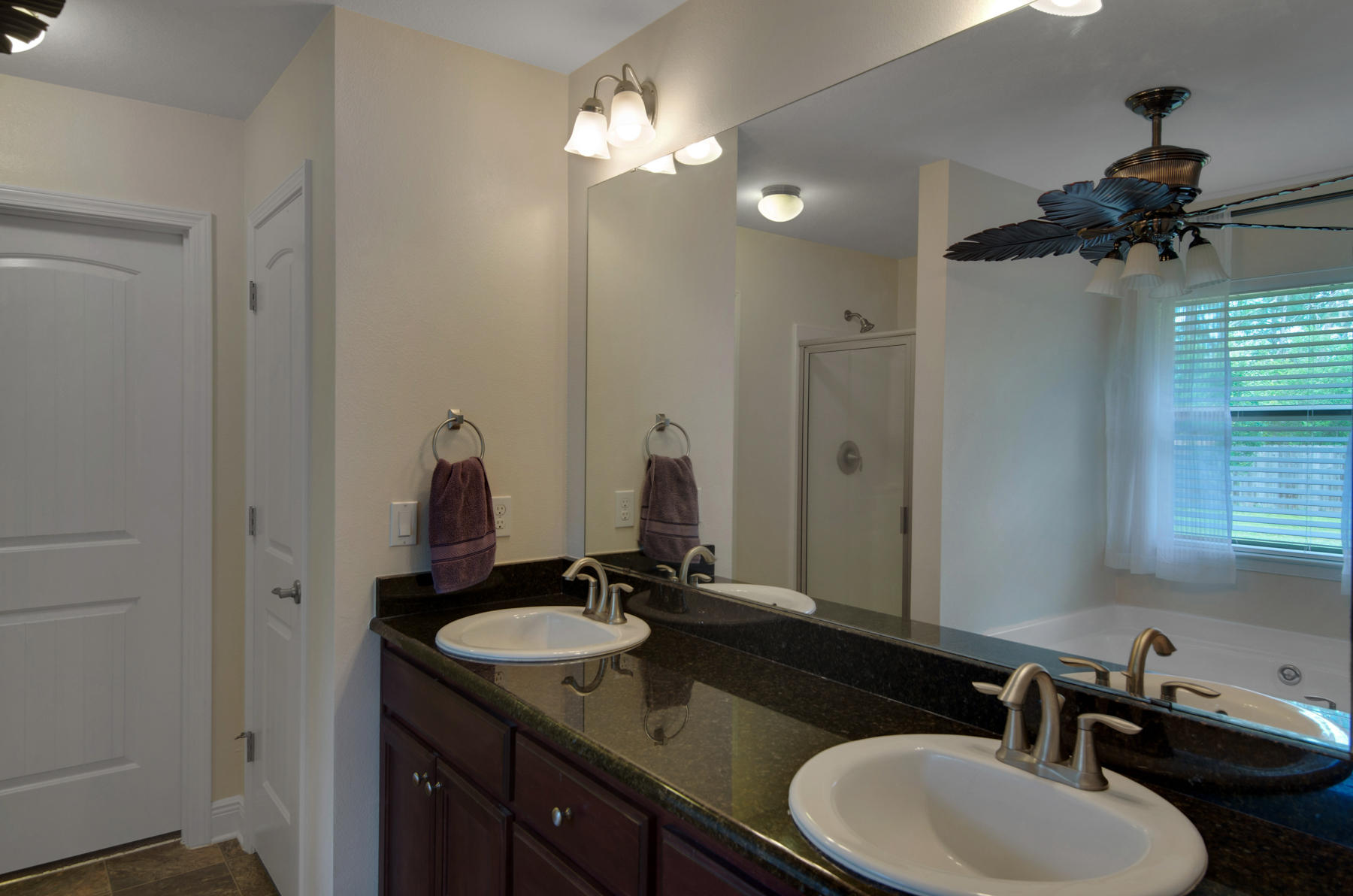 2383 Crescent Road Navarre, FL 32566 - Photo 20 of 48 a bathroom with a double vanity sink and a mirror