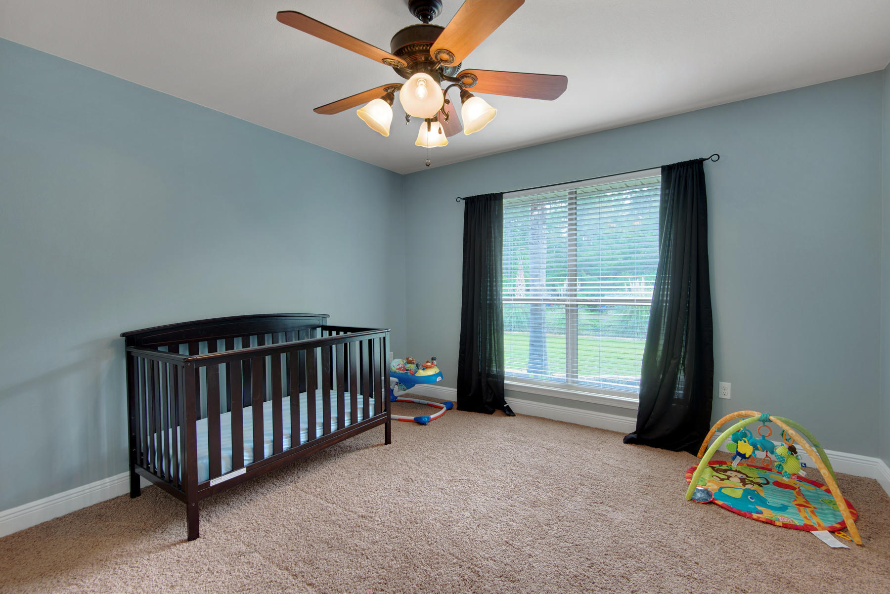 2383 Crescent Road Navarre, FL 32566 - Photo 21 of 48 a bedroom with a bed and a chandelier