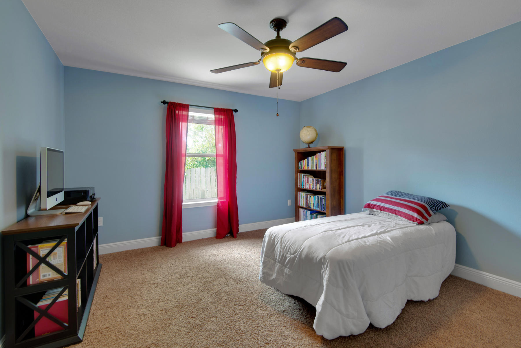 2383 Crescent Road Navarre, FL 32566 - Photo 23 of 48 a bedroom with a bed and a chandelier
