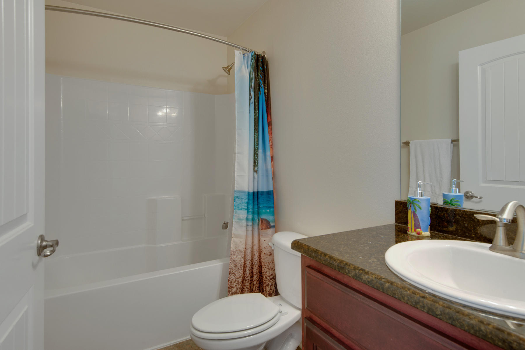 2383 Crescent Road Navarre, FL 32566 - Photo 25 of 48 a bathroom with a granite countertop sink toilet a mirror and shower
