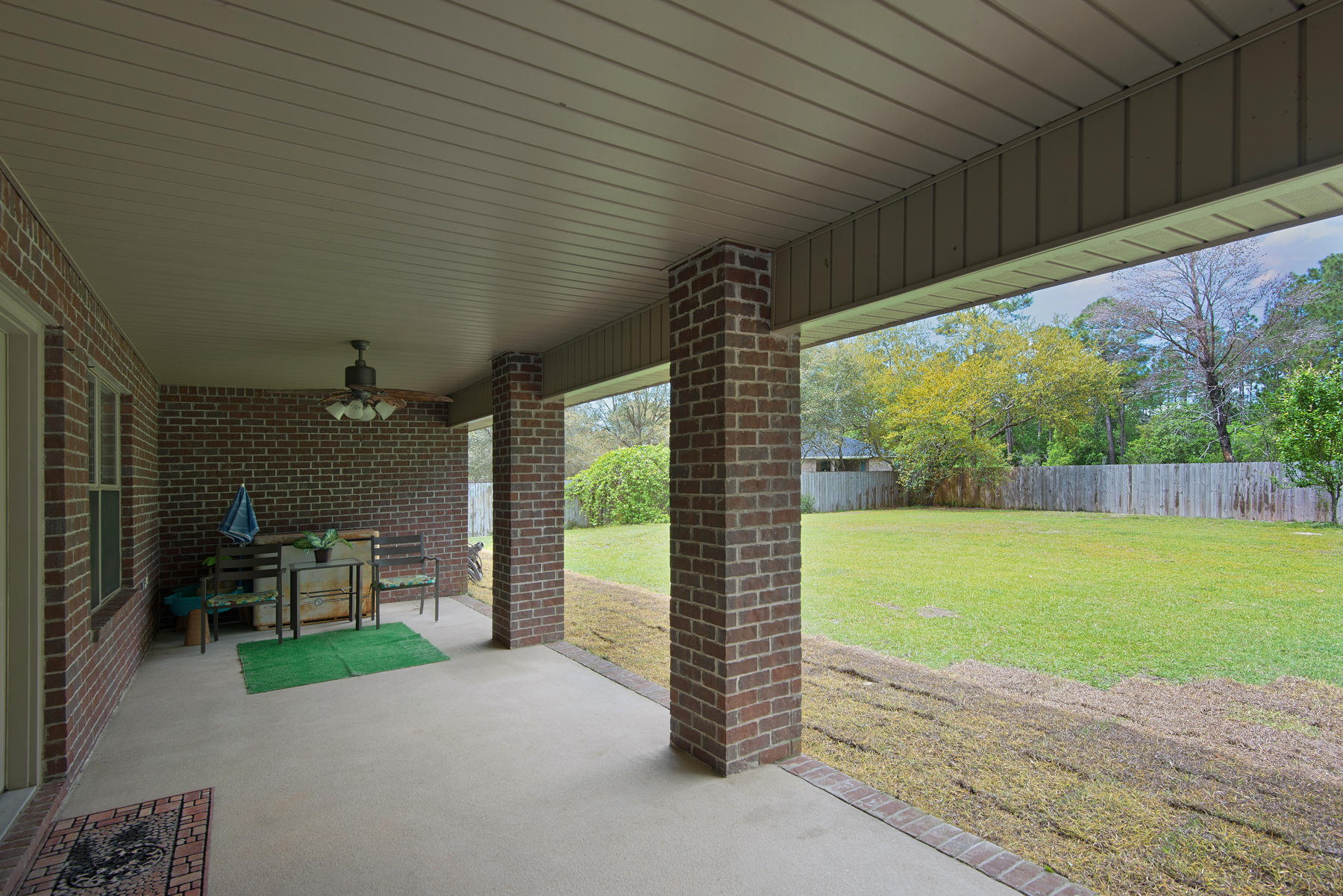 2383 Crescent Road Navarre, FL 32566 - Photo 26 of 48 a view of a patio with backyard