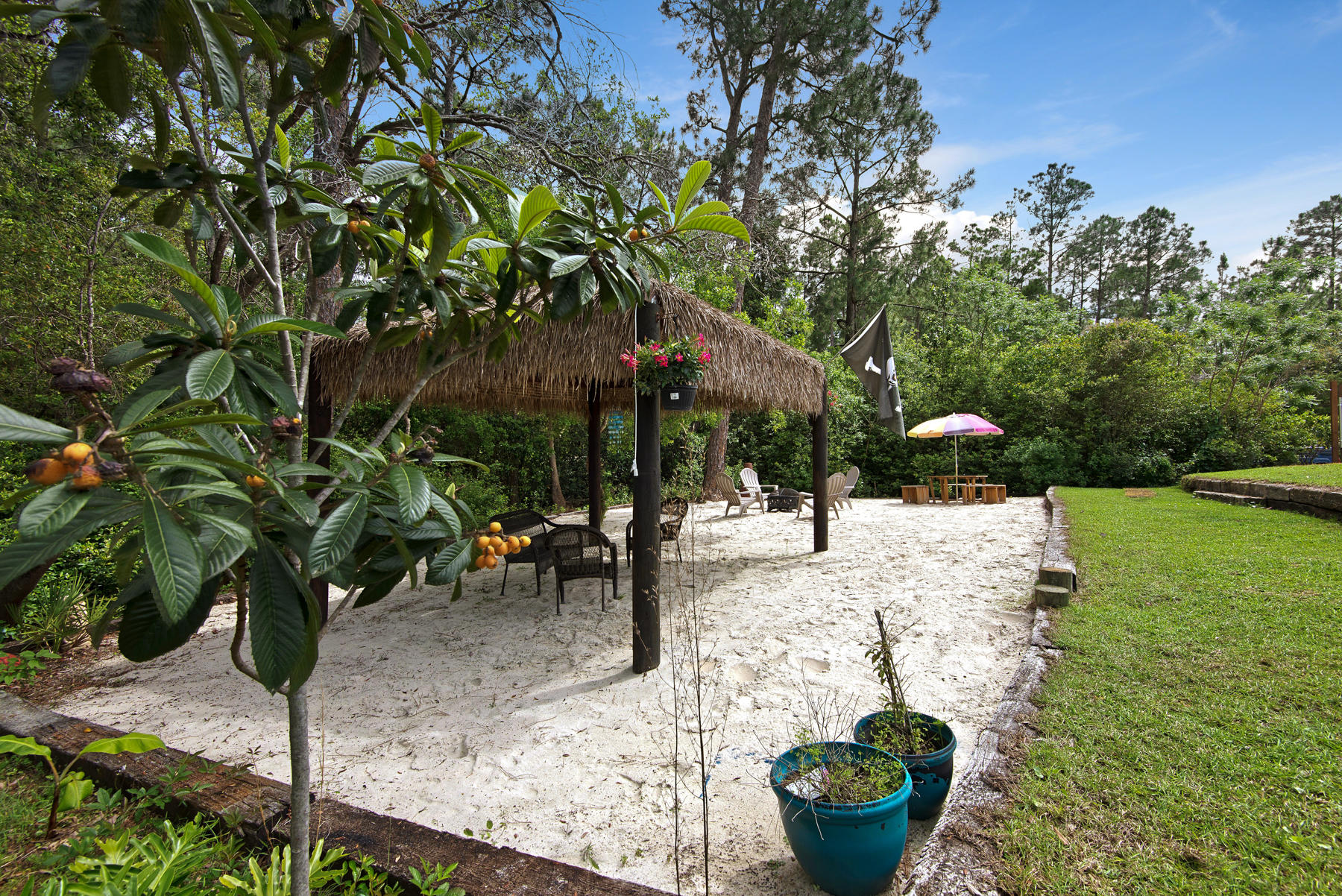 2383 Crescent Road Navarre, FL 32566 - Photo 28 of 48 a view of a backyard with sitting area