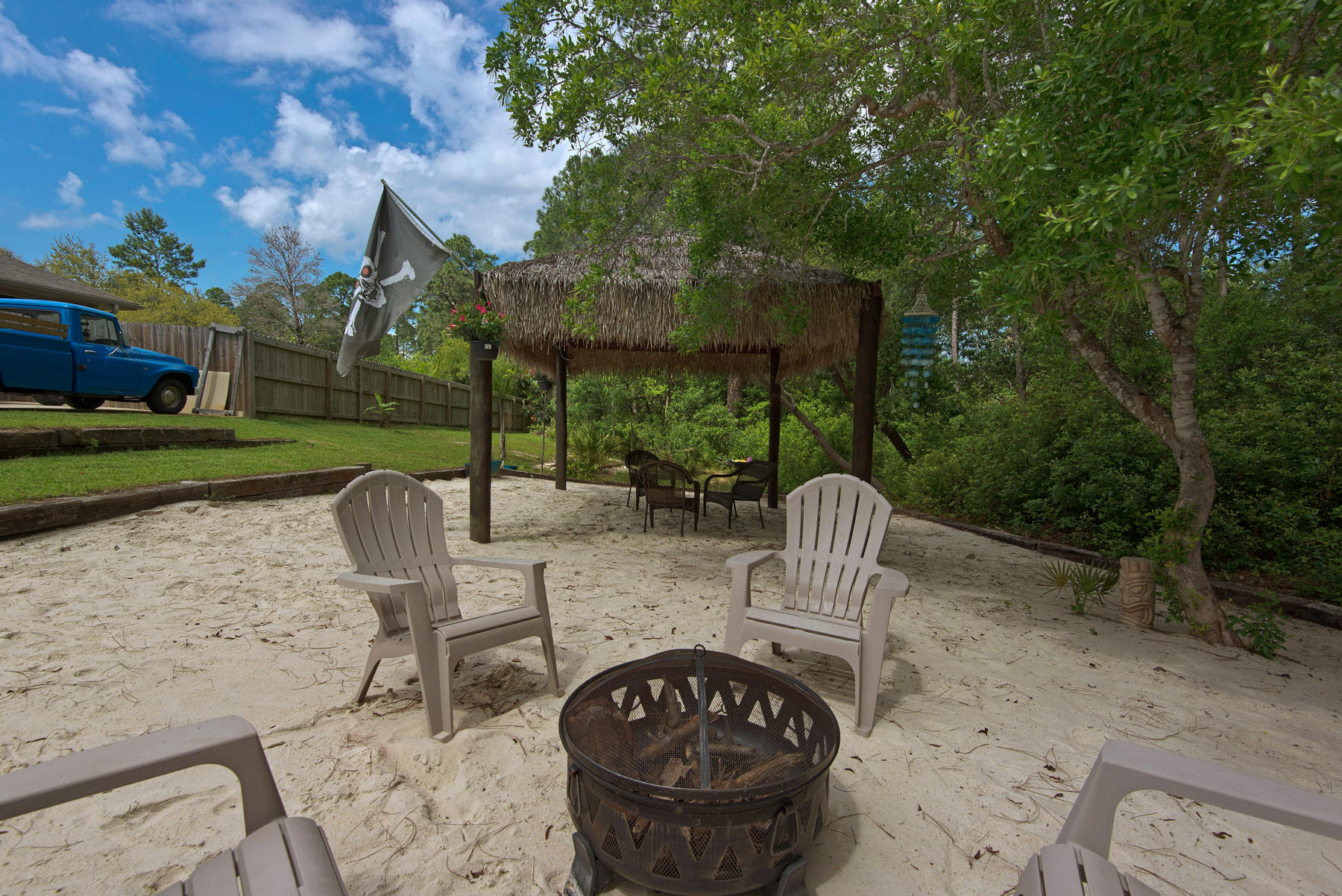 2383 Crescent Road Navarre, FL 32566 - Photo 30 of 48 a view of a patio with a table chairs and a backyard