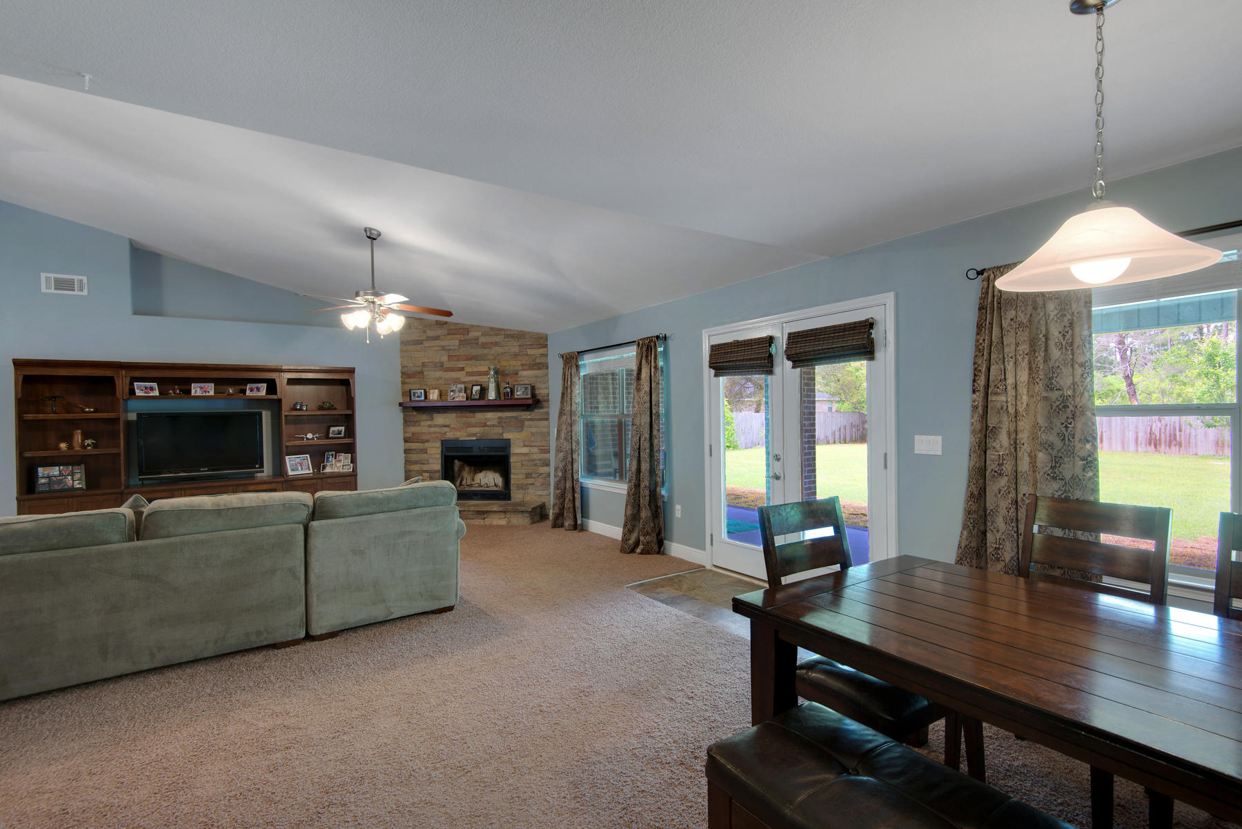 2383 Crescent Road Navarre, FL 32566 - Photo 36 of 48 a living room with furniture and a flat screen tv