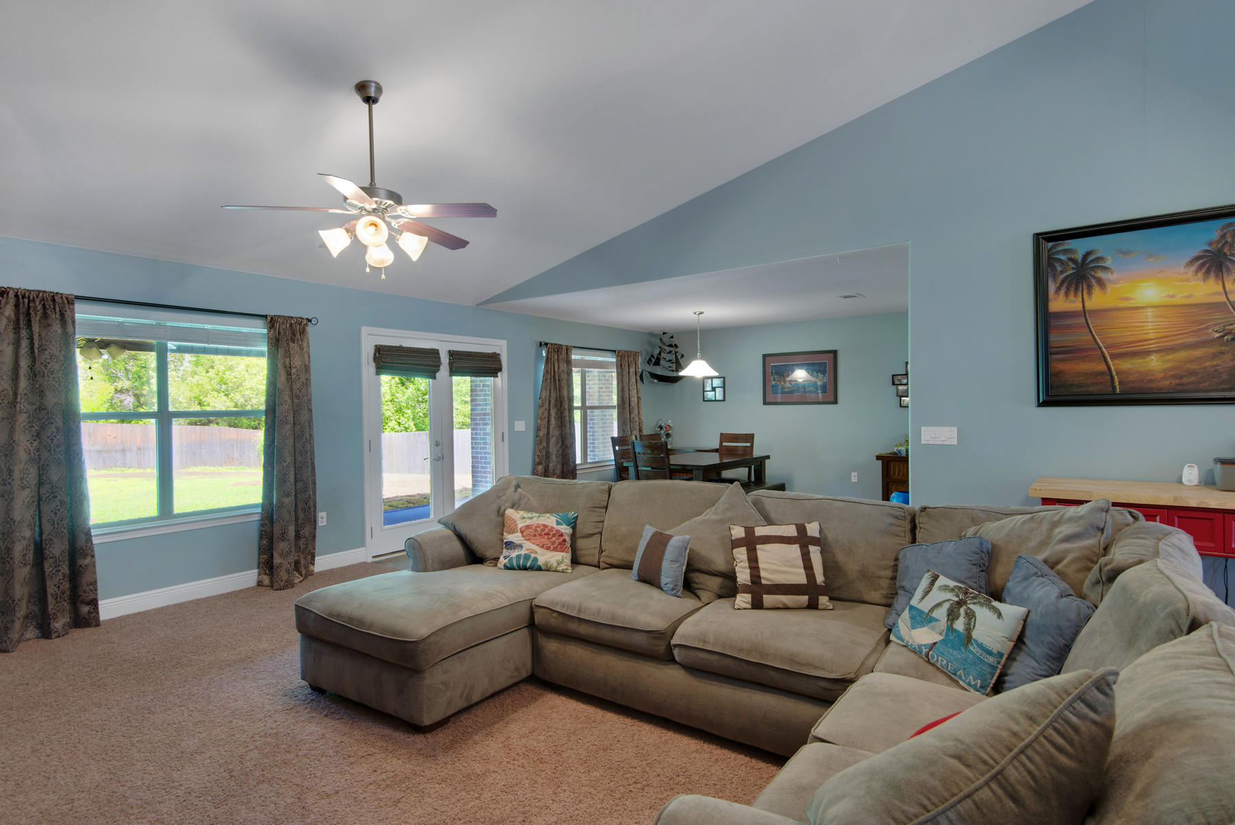 2383 Crescent Road Navarre, FL 32566 - Photo 38 of 48 a living room with furniture ceiling fan and a large window