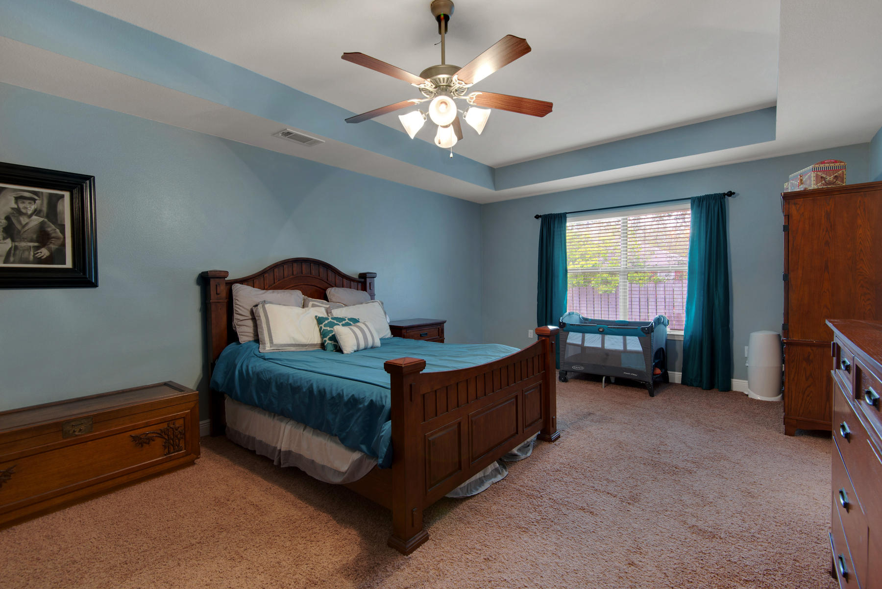 2383 Crescent Road Navarre, FL 32566 - Photo 39 of 48 a bedroom with a bed and a chandelier