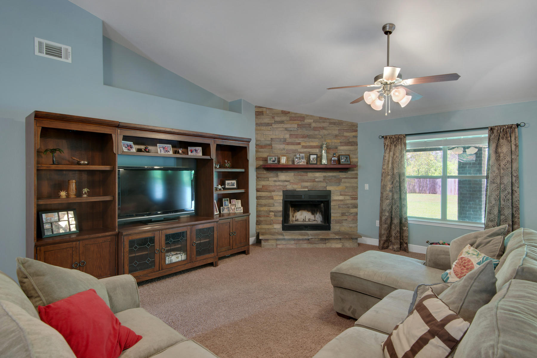 2383 Crescent Road Navarre, FL 32566 - Photo 4 of 48 a living room with furniture and a flat screen tv