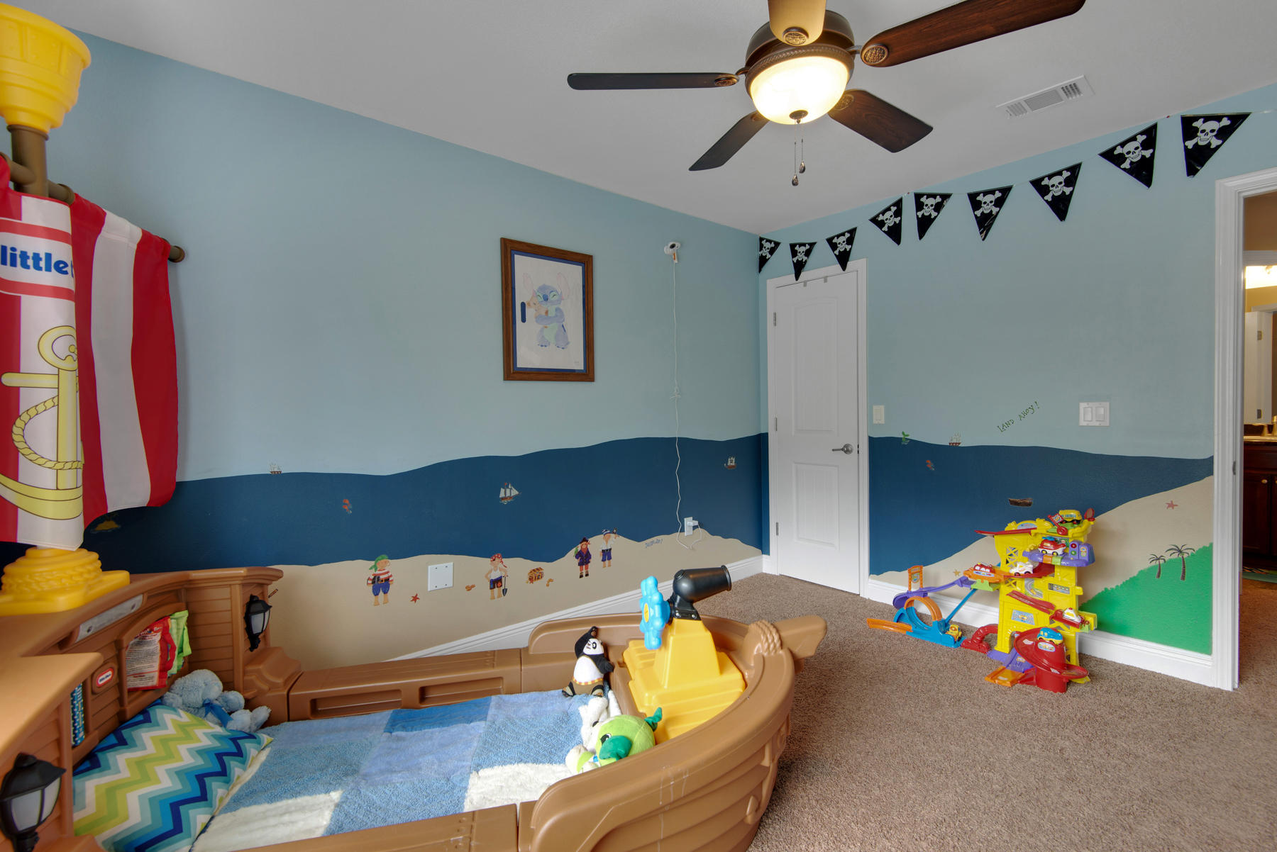 2383 Crescent Road Navarre, FL 32566 - Photo 41 of 48 a bedroom with a bed and a chandelier
