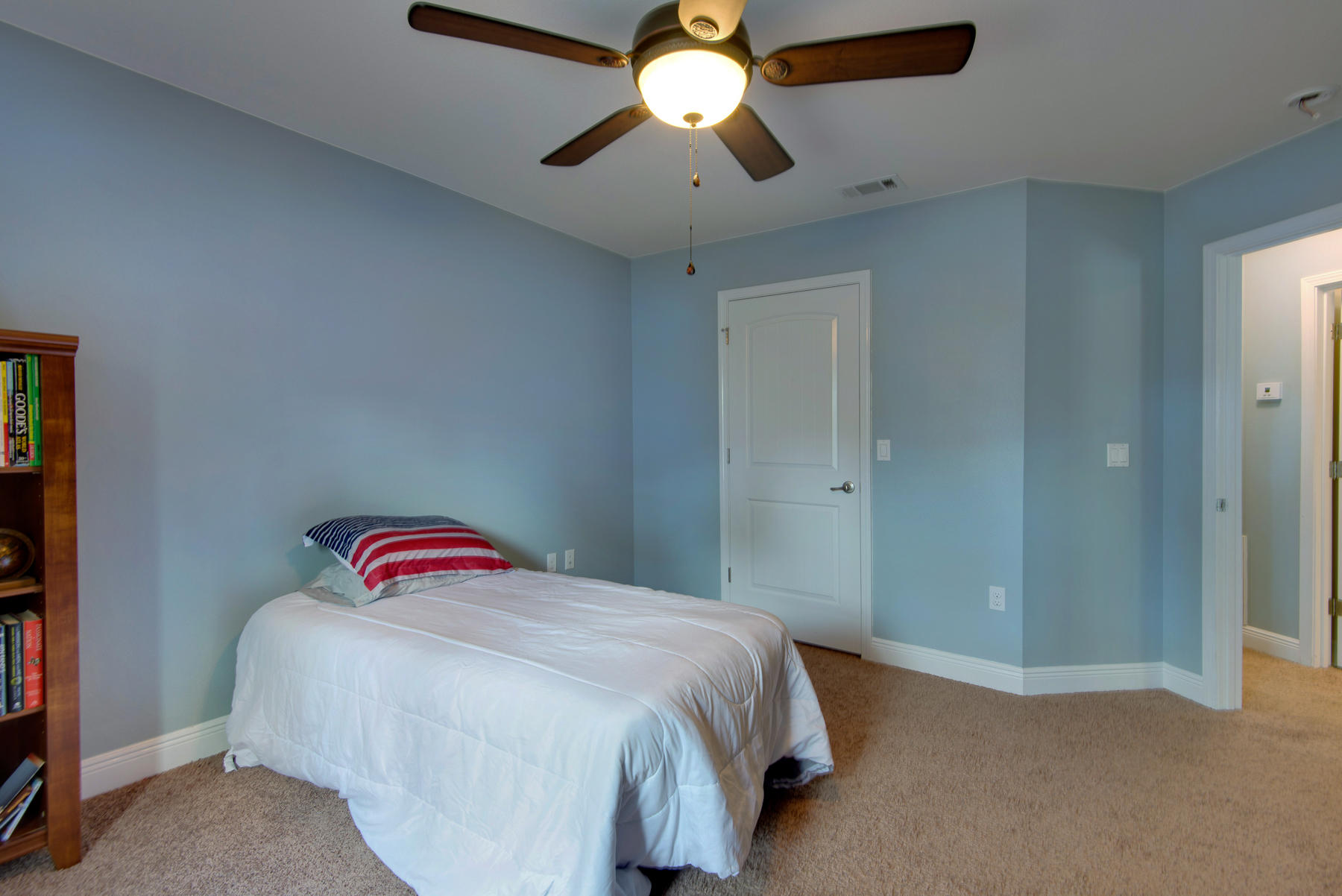 2383 Crescent Road Navarre, FL 32566 - Photo 42 of 48 a bedroom with a bed and a chandelier