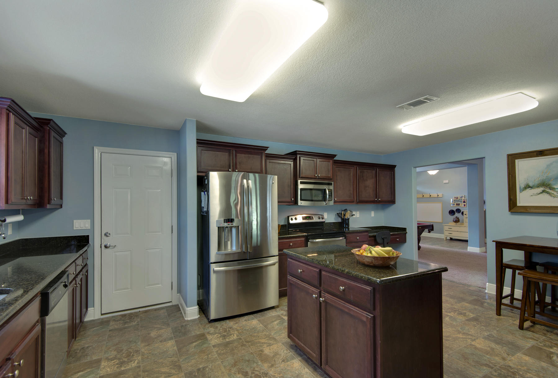 2383 Crescent Road Navarre, FL 32566 - Photo 43 of 48 a kitchen with a refrigerator stove and sink