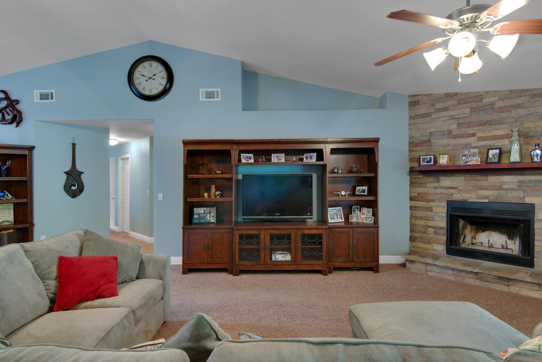 2383 Crescent Road Navarre, FL 32566 - Photo 7 of 48 a living room with furniture a flat screen tv and a fireplace